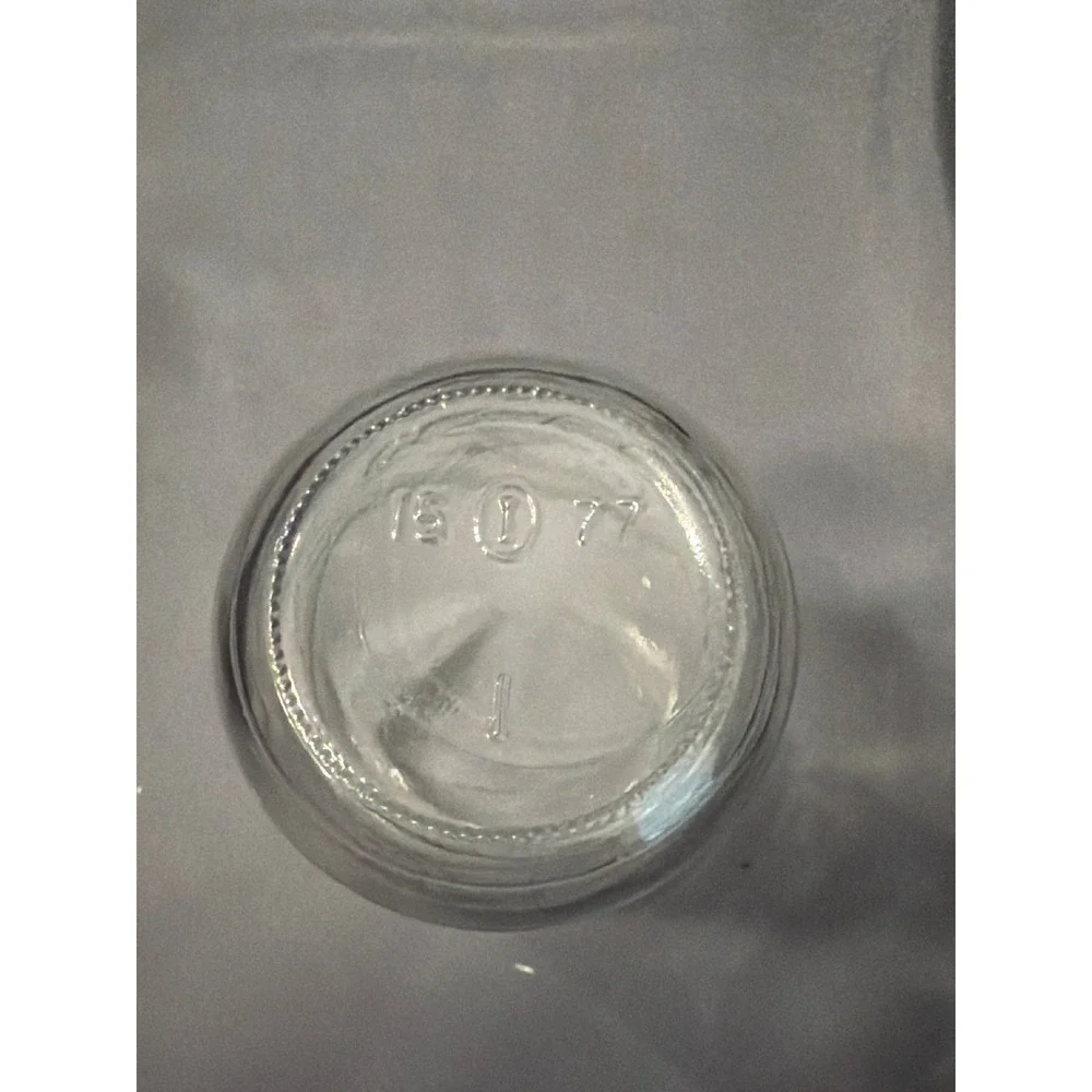 Vintage Clear Glass Jar Embossed Cultural Symbols Figures 15 I 77 Marked Base